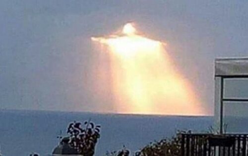 “Christ the Redeemer” Seen Radiating Light Through Clouds in Photo Taken by Man