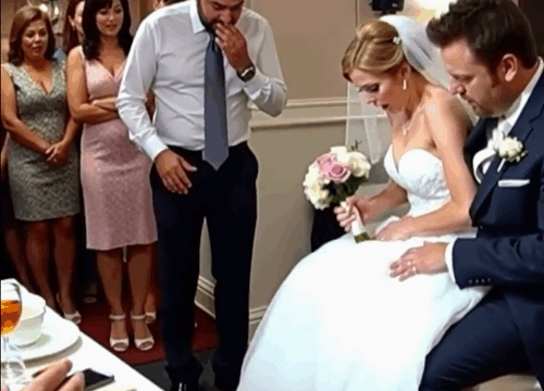 Right in the middle of the wedding, something stirred beneath the bride’s dress — and the groom’s expression instantly changed.