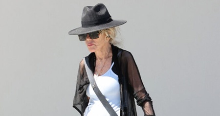 70s Screen Legend Turns Heads While Walking Her Dogs