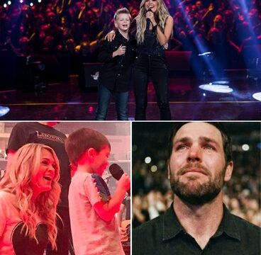 A surprise moment at Carrie Underwood’s concert transformed the arena from a grand spectacle into hushed stillness when her young son stepped onstage to sing as she softly played the piano. Fixated on his father in the front row, his trembling, imperfect voice turned the performance into a deeply personal family moment. As Mike Fisher wiped away tears and Carrie played protectively beside her son, the audience realized they were witnessing something far more intimate than a concert.