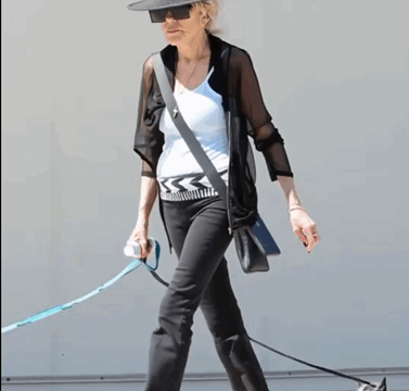 ’70s Screen Legend Turns Heads While Out Walking Her Dogs