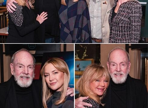 Under the soft glow of the theater lights, Goldie Hawn and Neil Diamond shared a quiet, almost private moment. No speeches. No staged smiles. Just two lives, full of history and hardship, pausing together in mutual recognition of all they’ve endured — and all that still lies ahead. Family framed the scene: Kurt Russell beside Goldie, Katie Diamond beside Neil, anchoring it in something real and tender. The air was soft with vulnerability, gratitude unspoken but felt. This wasn’t about fame or applause. It was about resilience, reinvention, and the grace that comes with time. The warmth between them wasn’t scripted. It was earned — decades of living, falling, standing, and continuing. In that moment, Song Sung Blue was more than a performance. It was a reflection of memory, love, and strength that doesn’t fade. Some of life’s most powerful moments need no words; they just need presence.